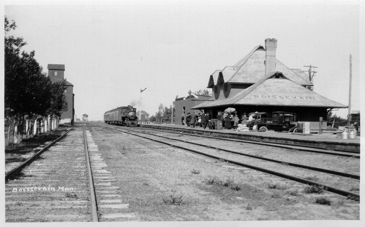 [Scanned photo of the railroad station looking west along the tracks from Broadway]