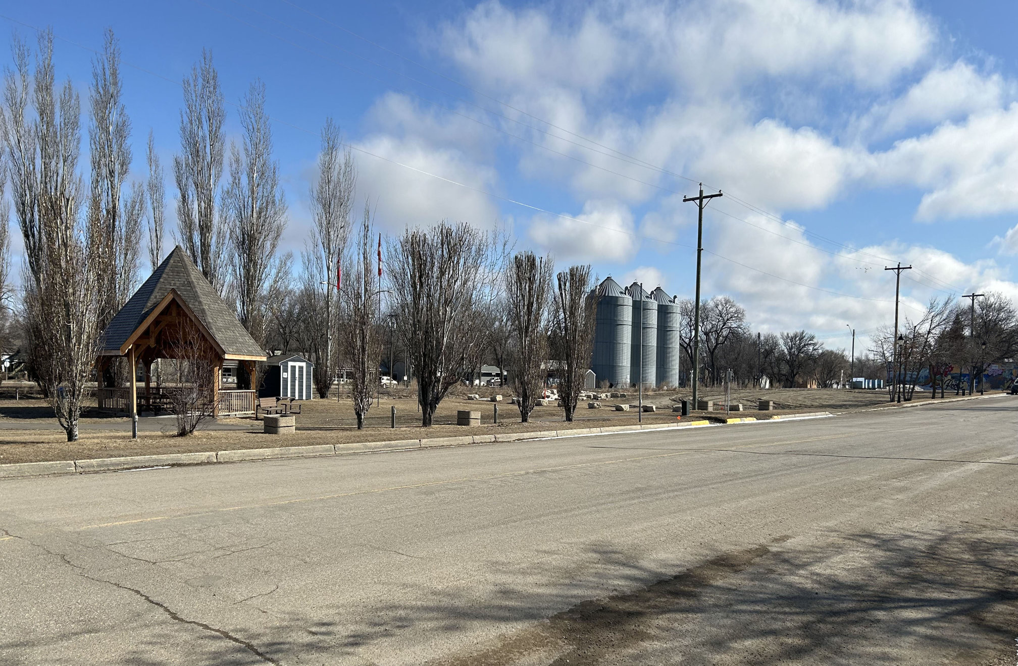 [2024 photo of South Railway Street looking northeast toward the railway with the community gazebo on the left]