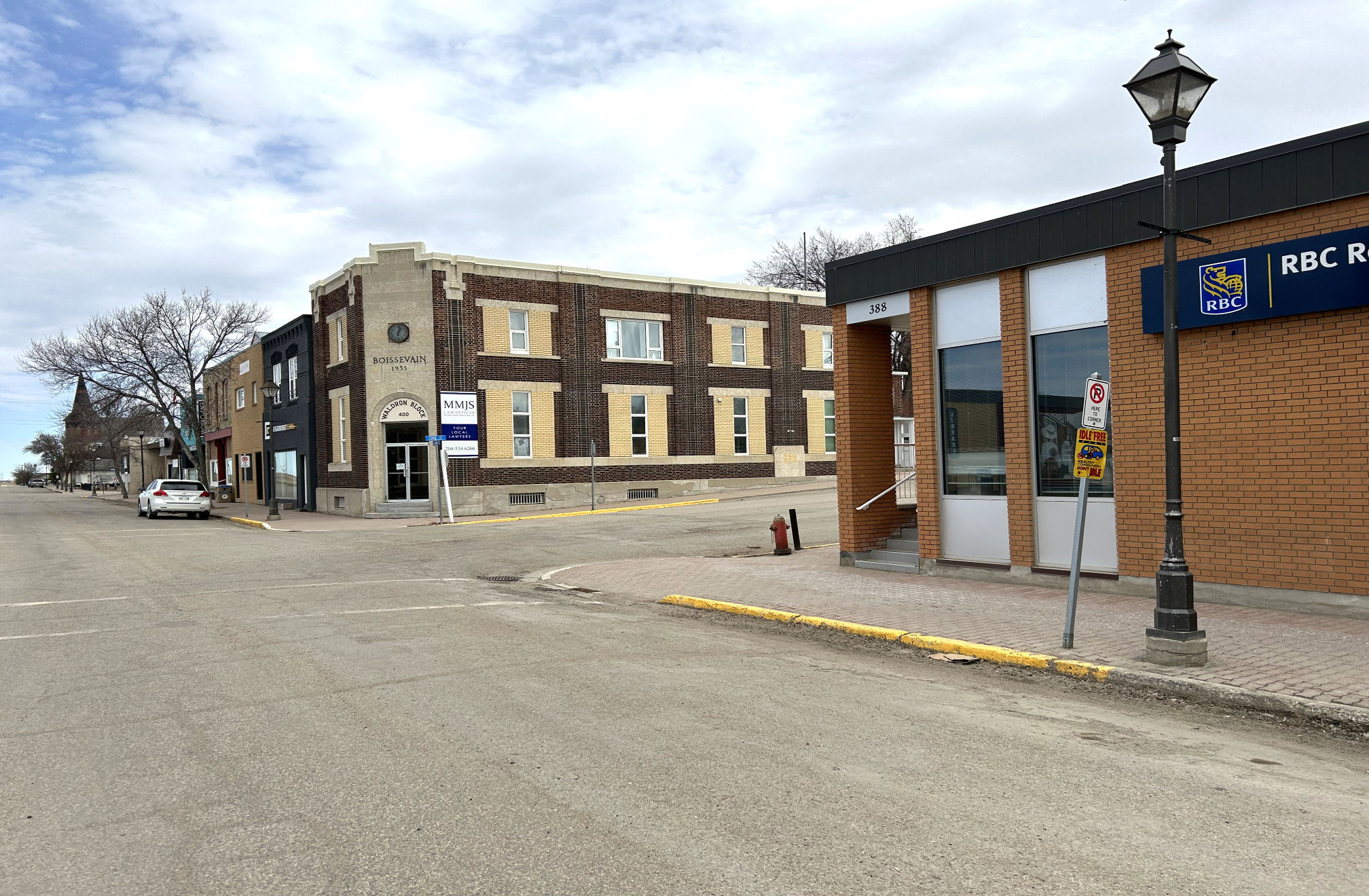 [2024 photo of South Railway looking east from the Royal Bank building at the Cook Street intersection]